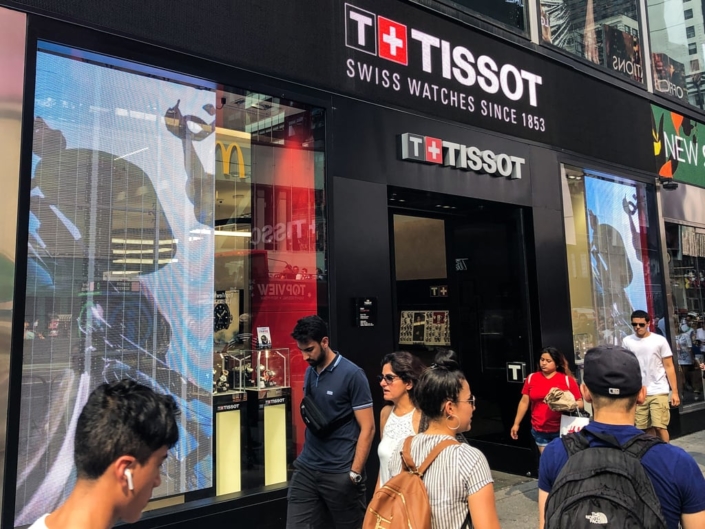 Tissot Transparent LED Window Signage with Multiple Cyclists