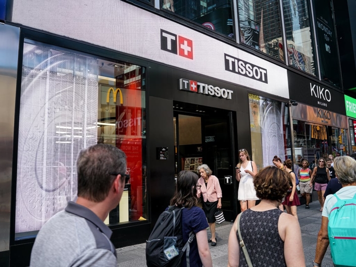 PixelFLEX Transparent LED Tissot Storefront Signage with passerbys